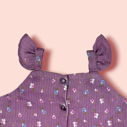 neck view of The Purple Floral Lawn Frock is printed with purple flowers